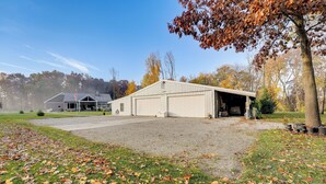 A large, single-story building with a garage and a covered driveway.