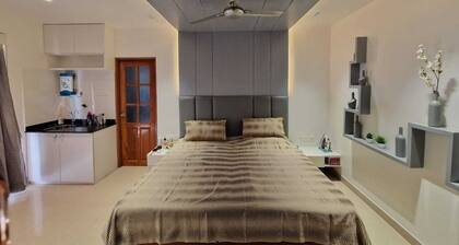 2 x King Size en suite bedrooms with wardrobes with fridge and filtered water.