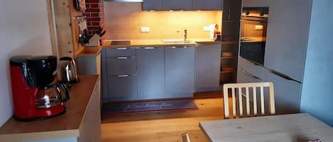 Fridge, stovetop, coffee/tea maker, electric kettle