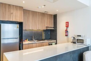 Classic Apartment | Private kitchen | Full-size fridge, microwave, oven, toaster