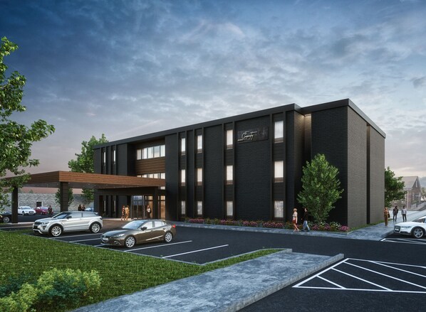 A modern building with a dark facade, large windows, and a sign that reads "Chicory." - The Carpentry Hotel (Dalton)