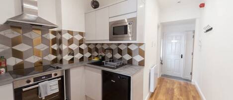 Fridge, microwave, oven, dining tables