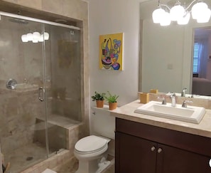 Shower, hair dryer, towels, soap