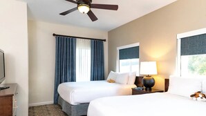 A hotel room with two beds, a ceiling fan, a TV, and a window with curtains. - Wyndham Vacation Resort! Serene · Clean · Fun! (Branson)