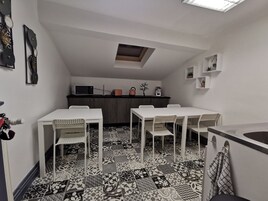 Mini-fridge, microwave, stovetop, coffee/tea maker