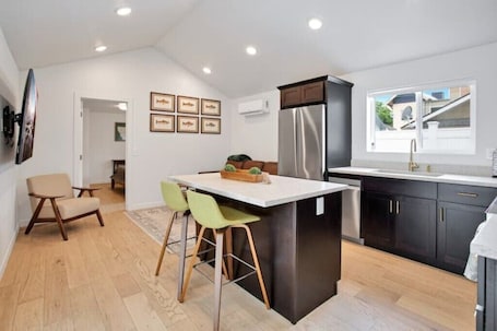 Fridge, microwave, oven, stovetop. Retro Revival: Your Stylish Stay