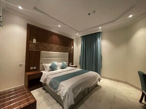 Desk, laptop workspace, free WiFi, bed sheets