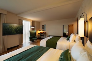 Relax in comfort with two spacious beds, a flat-screen TV, and a desk for work or leisure.