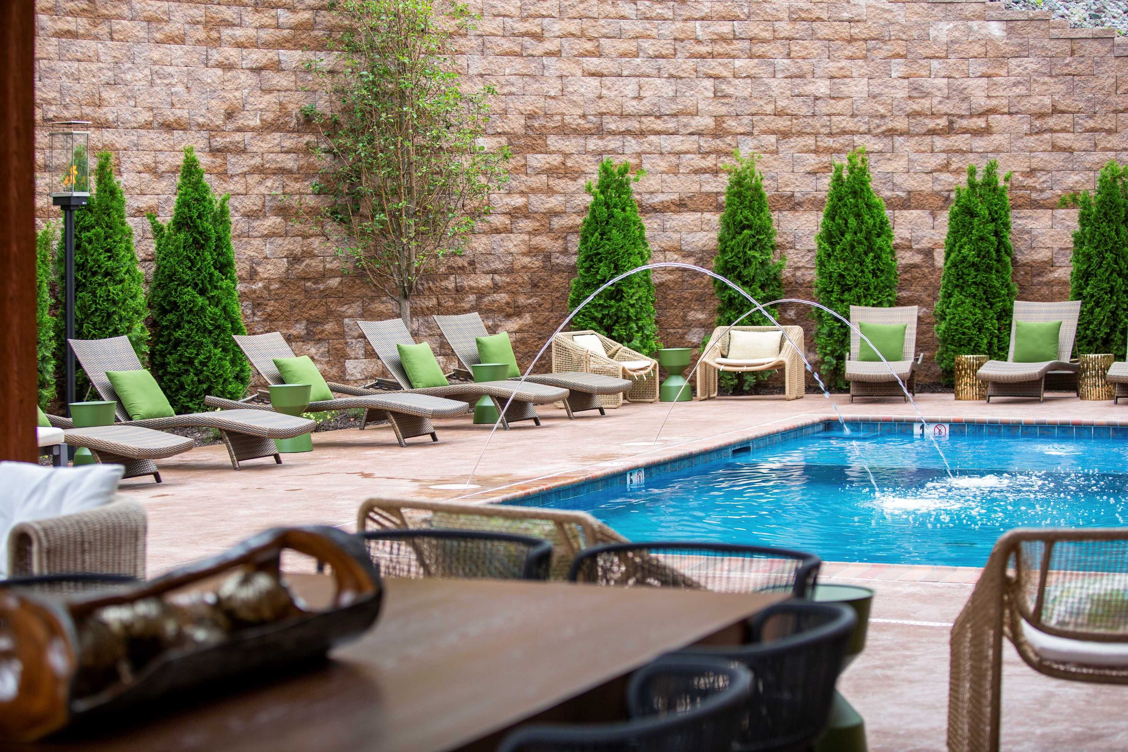 A poolside area with lounge chairs and a small pool.