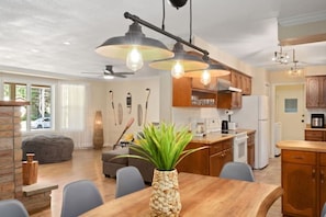 Enjoy cooking in this well-equipped kitchen with a central island, oven, and refrigerator.