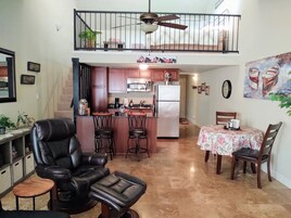 Comfort Condo | Living area | 55-inch Smart TV with cable channels