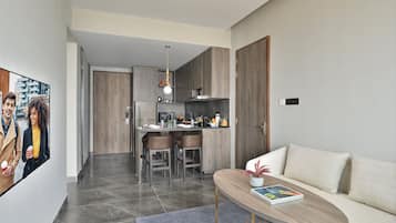 Premier Room, 2 Bedrooms | Living room | 43-inch flat-screen TV with satellite channels, Netflix