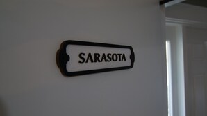 A sign on a wall that reads "SARASOTA".