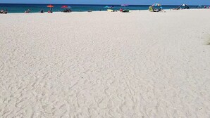 A beach with white sand, clear blue sky, and a calm sea. - Casey Key/Nokomis Florida home, minutes to the beach (Nokomis)