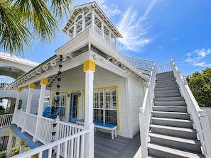 A white building with a balcony and a staircase. - Panoramic Ocean View ☀️ Near Beach | Family Friendly | Saltwater Pool ☀️ Barbie Bathroom! (Santa Rosa Beach)