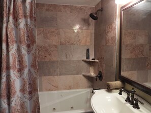Jetted bath, hair dryer, towels, soap