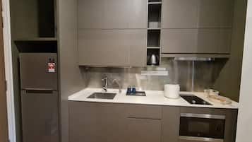 Fridge, microwave, electric kettle, cookware/dishes/utensils