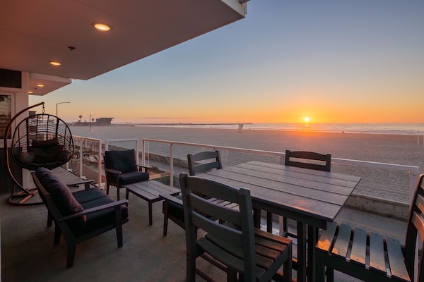 A spacious balcony with ample seating, offering stunning ocean views.