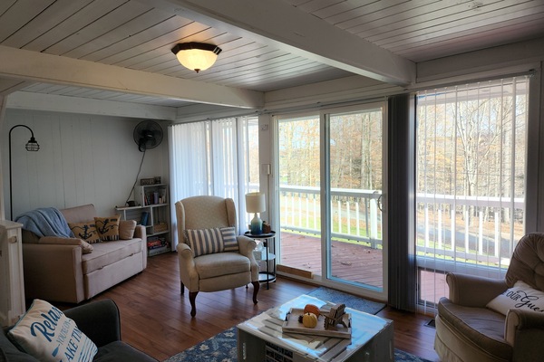 living room with reading nook window wall