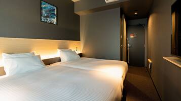 A hotel room with a large bed, a headboard, an air conditioning unit, a painting on the wall, and a door leading to another room.