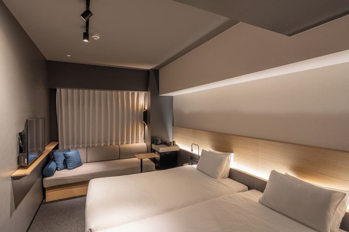 Chambre Deluxe avec lits jumeaux, 2 chambres, non-fumeur, en angle (Corner)