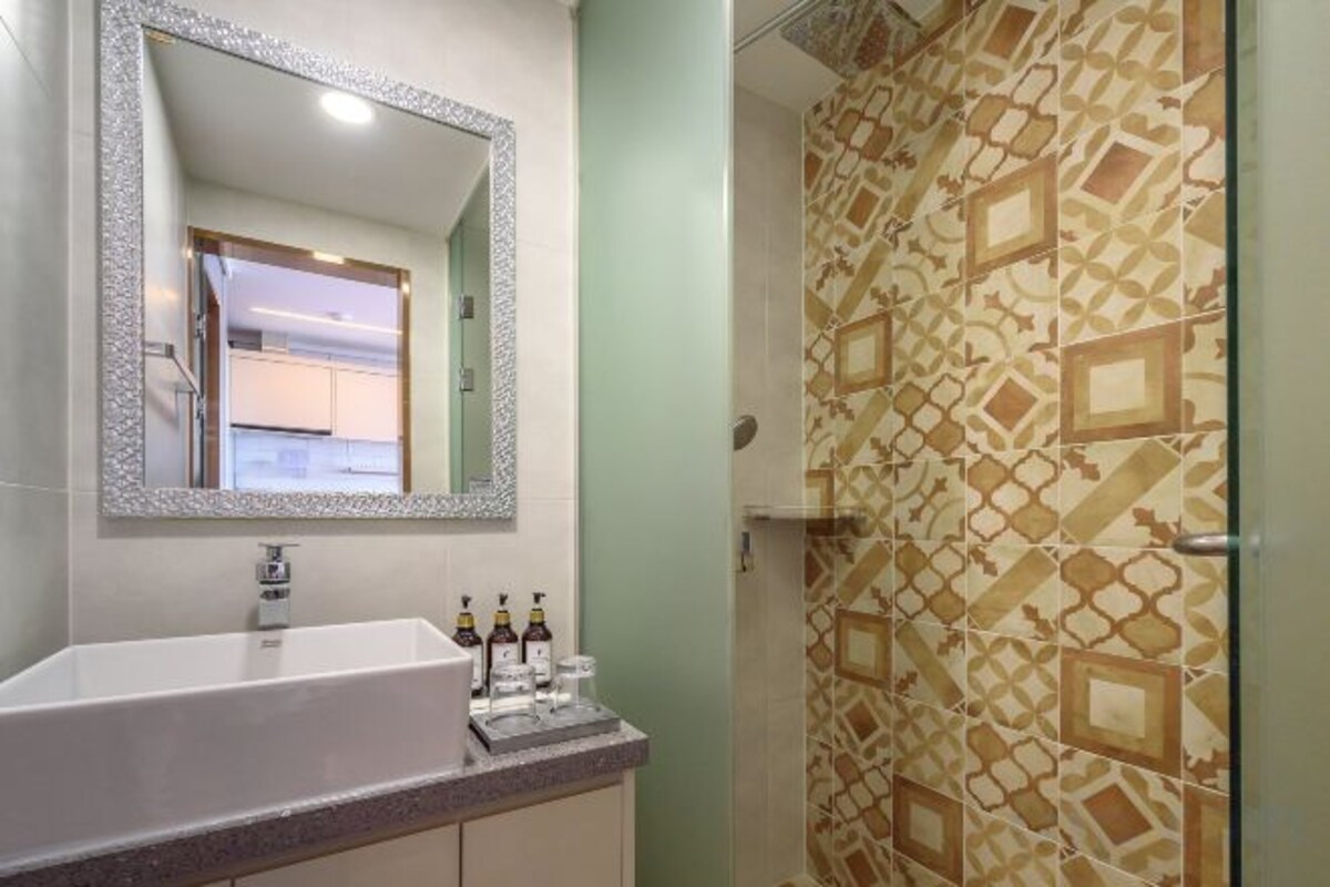 Bathroom | Shower, rainfall showerhead, hair dryer, slippers