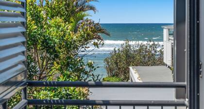 Wake up each morning just steps away from 7-mile Beach and the iconic boardwalk