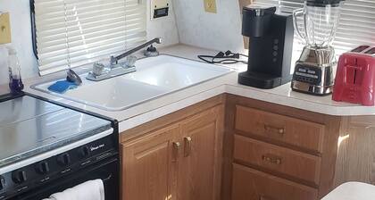 Cosy 29ft travel trailer on our property. Also 2 full hookup RV sites
