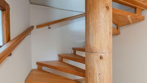 A wooden staircase with a handrail and a wooden post. - beim Kainzbauer by Interhome (Sankt Veit im Pongau)