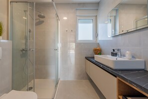 Exclusive Apartment, 2 Bedrooms, Pool View, Poolside | Bathroom | Shower, heated floors, towels, toilet paper