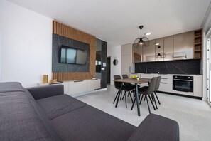 デラックス アパートメント 1 ベッドルーム テラス | 専用キッチン | 冷蔵庫、オーブン、コンロ、食器洗い機