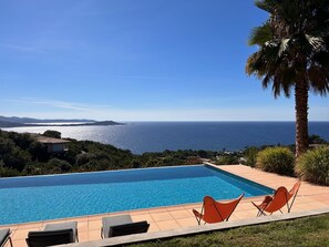 Relax by the pool with ocean views and lounge in style.