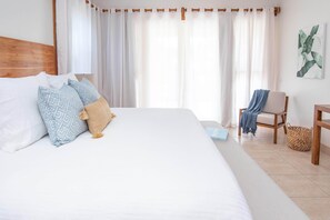 Premium bedding, down comforters, in-room safe, blackout drapes - The Phoenix Resort (San Pedro)