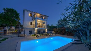 A two-story house with a swimming pool, outdoor seating, and a balcony. - Villa Elena (Kvarner - Poljica) (Poljica)
