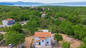 A two-story house with a red-tiled roof, surrounded by lush greenery and a mountainous backdrop. - Villa Elena (Kvarner - Poljica) (Poljica)