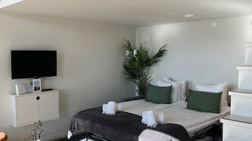 Superior Studio | Living area | 37-inch flat-screen TV with digital channels, streaming services