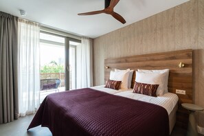 Apartment, Balcony, City View | In-room safe, desk, laptop workspace, iron/ironing board