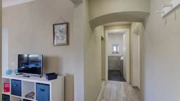 City Apartment | Living area | 35-inch flat-screen TV with digital channels