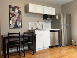 Fridge, microwave, coffee/tea maker, toaster