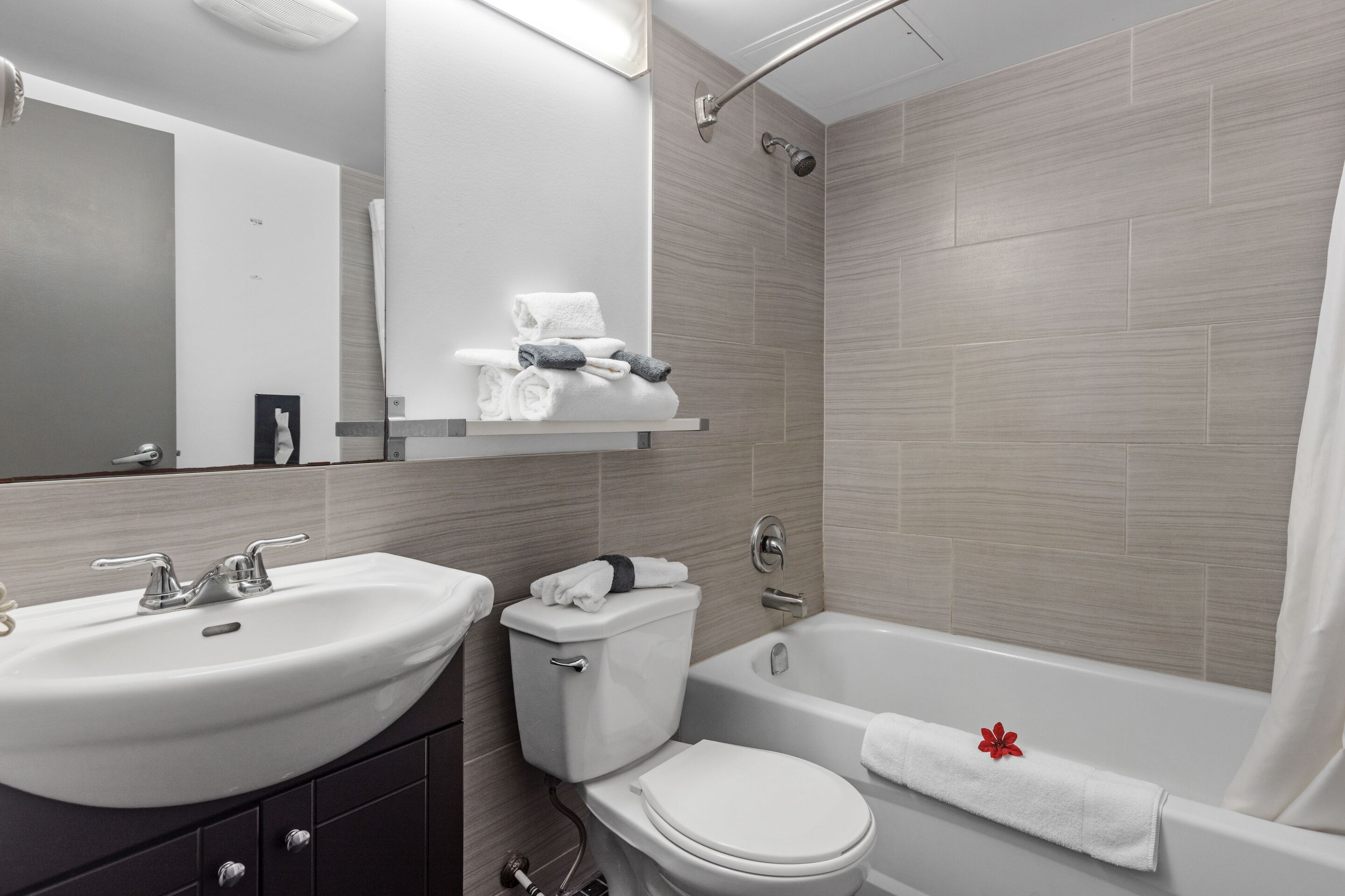 Separate bathtub and shower, rainfall showerhead, hair dryer, towels