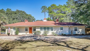 A single-story house with a red roof, a front porch, and a small front yard. - Beachy Wilmington Home: 6 Mi to Riverwalk + Dtwn! (Wilmington)