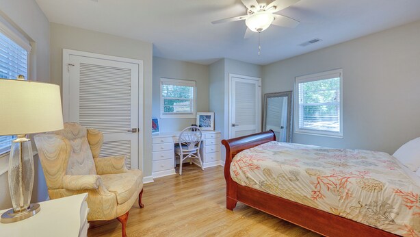 A bedroom with a bed, a desk, a chair, and a ceiling fan. - Beachy Wilmington Home: 6 Mi to Riverwalk + Dtwn! (Wilmington)