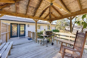 A wooden deck with a barbecue grill, benches, and a covered area with a wooden ceiling. - 4 Mi to Beach: Wilmington Home w/ Gazebo Deck! (Wilmington)