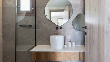 Shower, rainfall showerhead, hair dryer, towels