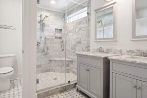 Shower, hair dryer, towels, shampoo