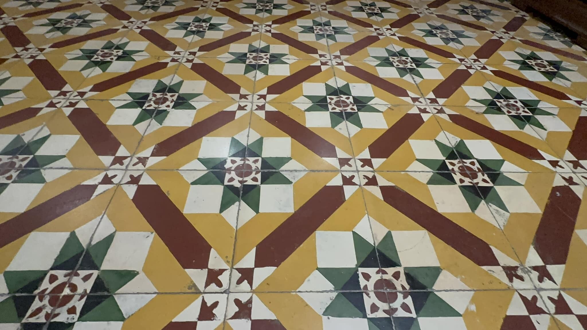 A patterned floor with a geometric design.