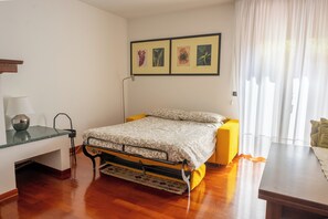 1 bedroom, desk, iron/ironing board, travel cot