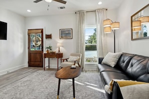 Duplex | Living area | 50-inch Smart TV with digital channels, streaming services - Magnolia Suites BSL (Bay St Louis)