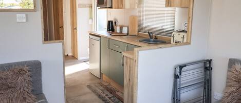 Fridge, electric kettle, toaster, cookware/dishes/utensils