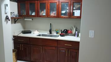 Microwave, stovetop, coffee/tea maker, cookware/dishes/utensils